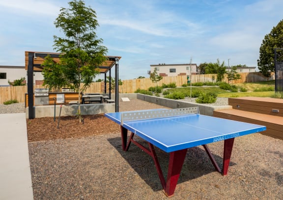 a fire pit and seating area outside of a building