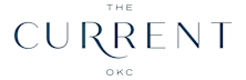 The image features the text "THE CURRENT OKC" in a large, cursive font.