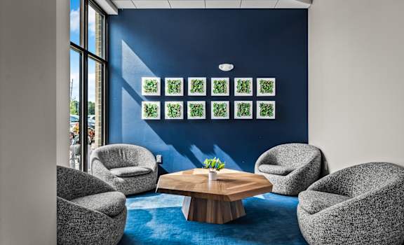 a group of chairs and a table in a room