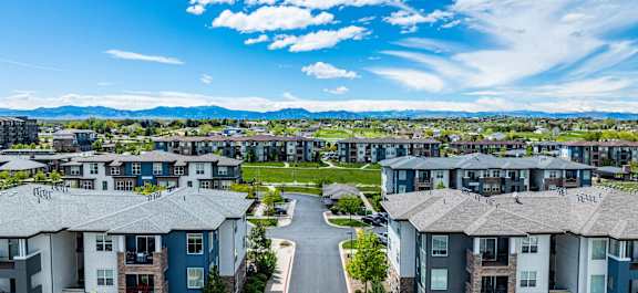 A large apartment complex with a road running through the middle.