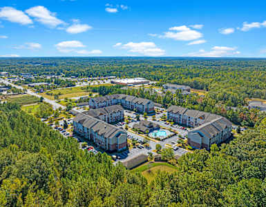 a aerial view of a building complex surrounded by trees