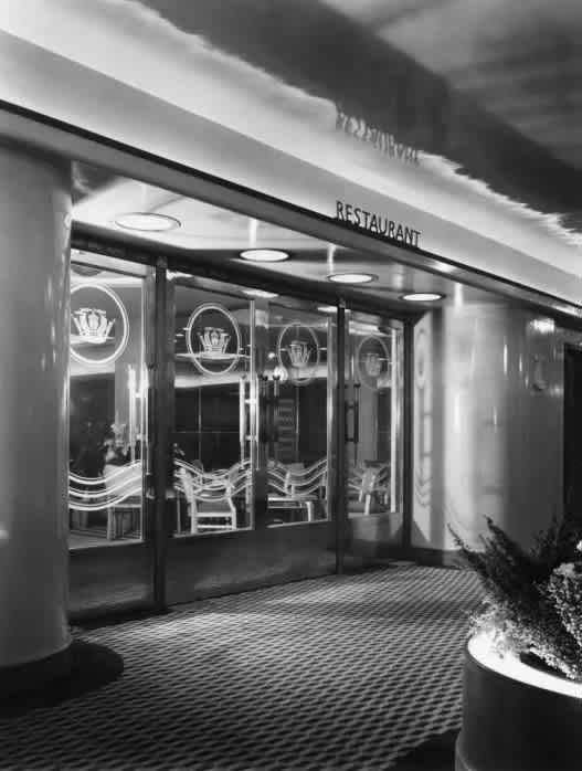 A black and white photo of a restaurant entrance.