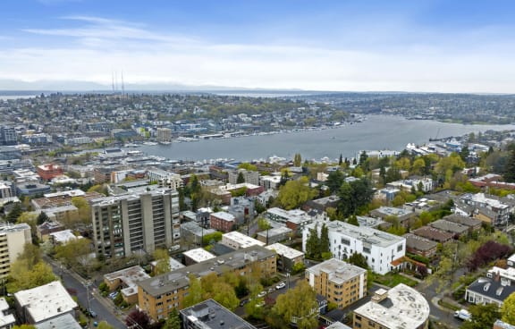 a view of the city from above with a river in the background