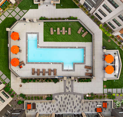 arial view of a swimming pool in the middle of a building at Avenue C Apartments, Billings, MT, 59102