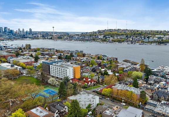 an aerial view of a city and a body of water