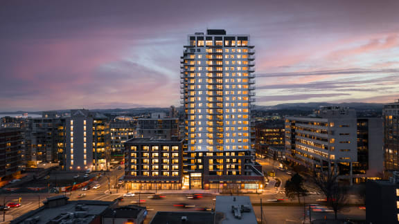 a tall building in the city of whistler at sunset