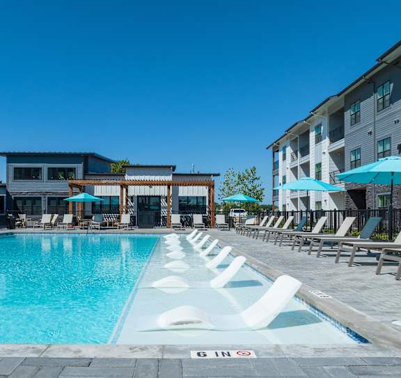 the gym with treadmills and weights at the belgard apartments at The Virginia, Seguin, 78155