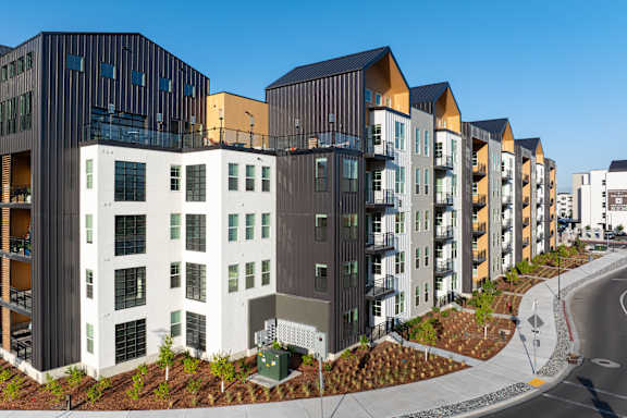 A row of modern buildings with balconies and windows at Solhavn Apartments, Utah, 84003