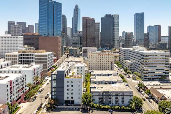 an aerial view of the city with buildings and skyscrapers
