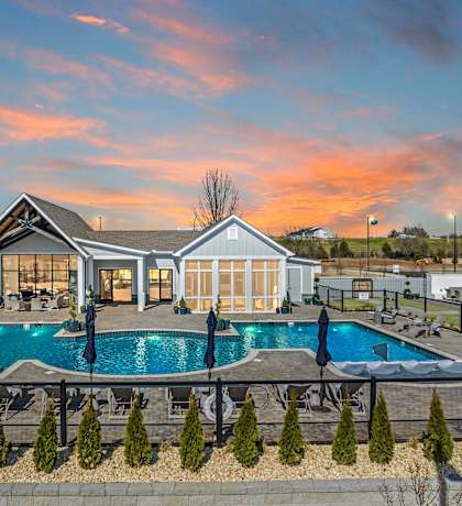A large house with a pool in the backyard. at Ovation at Town Madison, Madison, Alabama