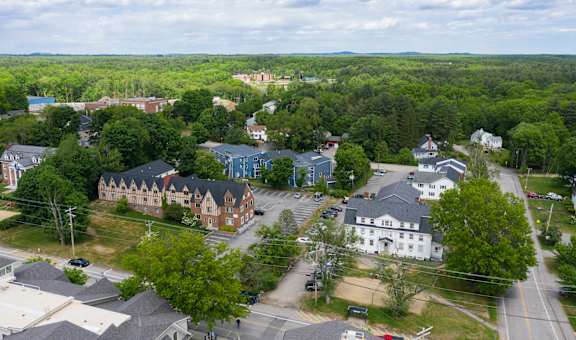 arial view of a small town with trees and buildings