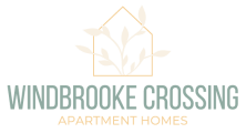 the logo for windbrooke crossing apartment homes