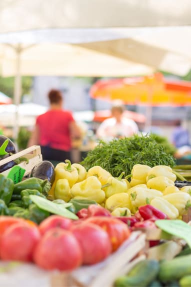 A market with a variety of vegetables on display.