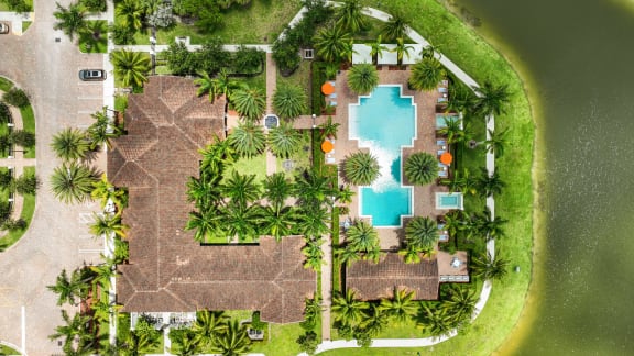a resort with a pool and palm trees