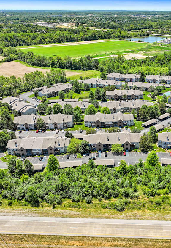 an aerial view of a neighborhood with houses and trees