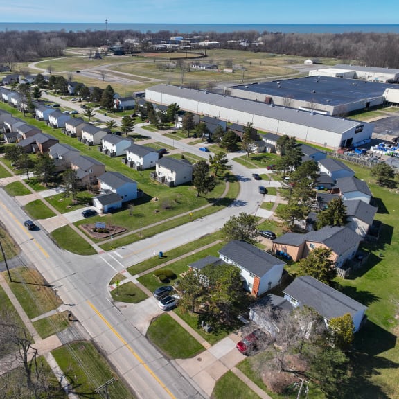 an aerial view of a neighborhood of houses and a highway