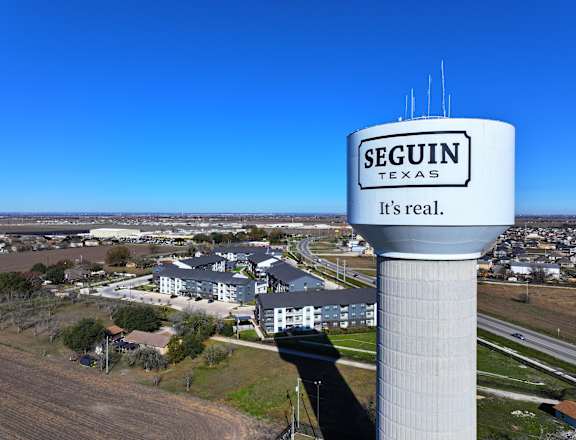A water tower with the word  at The Virginia Apartments , Texas, 78155