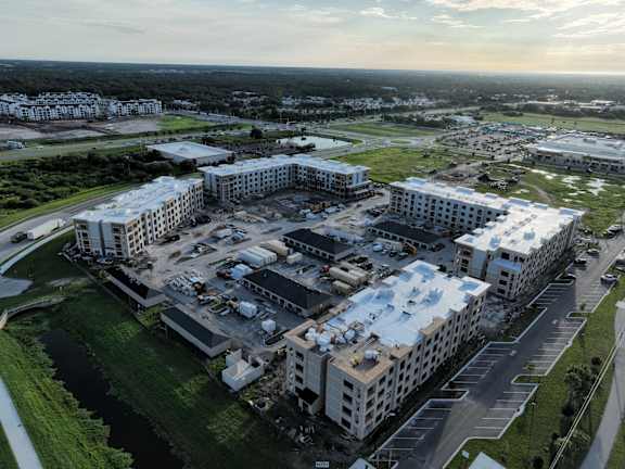 an aerial view of a city with buildings under construction at The Concord Apartments, Sarasota , FL 34240