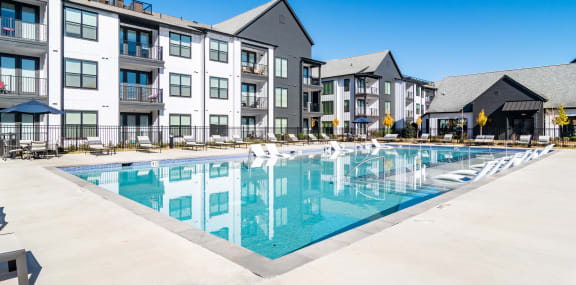 the swimming pool at the district flats apartments ga