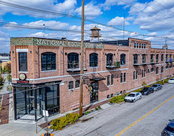 A National Bank building with cars parked in front.