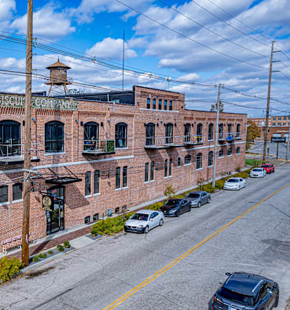 A National Bank building with cars parked in front.