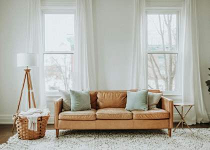 a living room with a couch and pillows