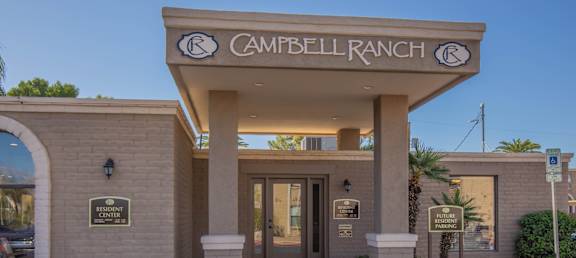 The entrance to the Campbell Ranch community with a sign above the door.