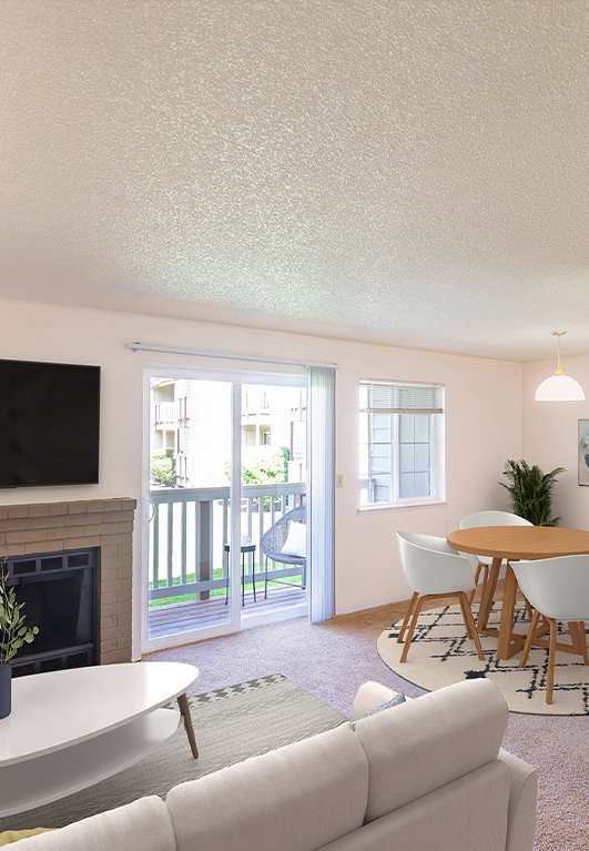 a living room with a fireplace and a kitchen