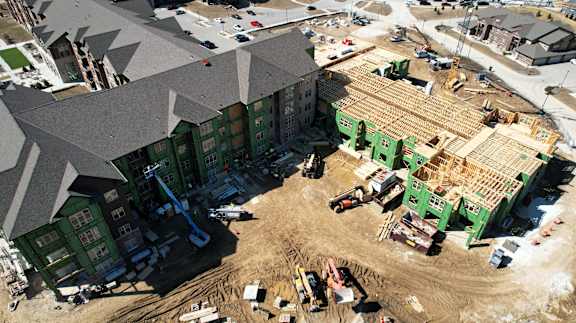 A construction site with a large building under construction.