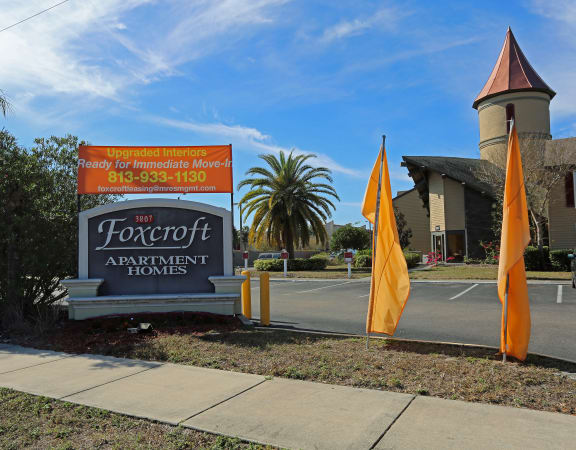 a sign in front of a building at Foxcroft Apartments, Tampa, 33614