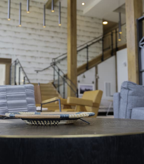 a coffee table with a tray on it in a living room with a staircase in the background at Preston Ridge, Hickory, NC 28602
