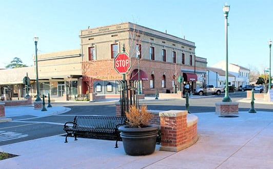 a stop sign on the corner of a city street