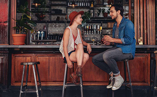 Man And Woman Talking In A Bar at 1415 @ The Yard, 1415 Cuming Street, Omaha, NE 68102