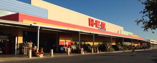 A HEB store with a blue sky in the background.