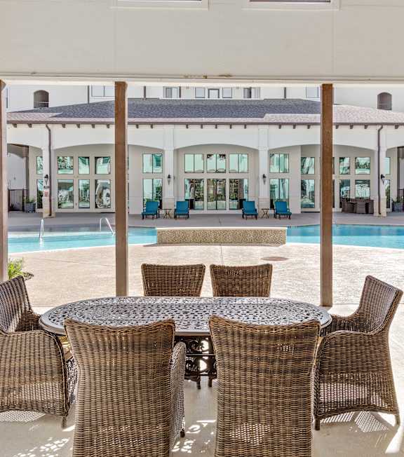 Enclosed seating area with pool view