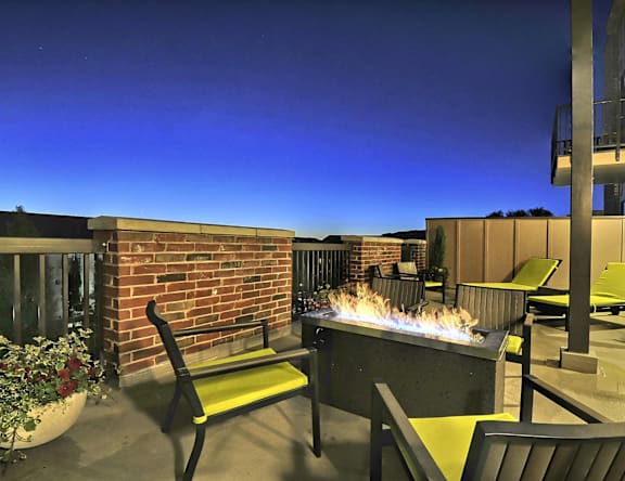 A patio with a fire pit and chairs at Sugar House Apartments By Urbana, Salt Lake City, UT, 84105