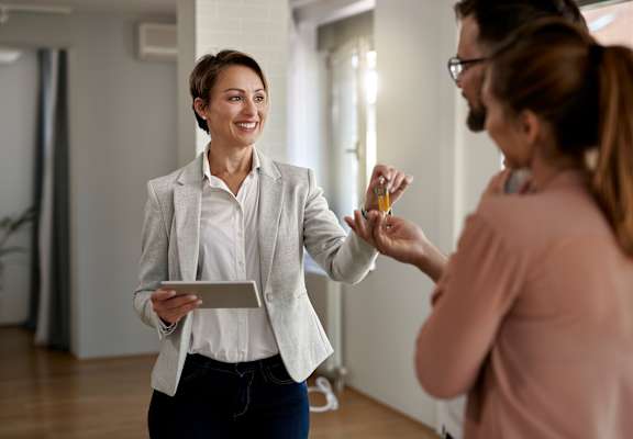 Leasing agent handing over keys at Kings Court, Alaska, 99501