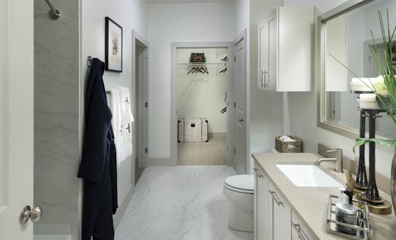A bathroom with a white toilet and sink.