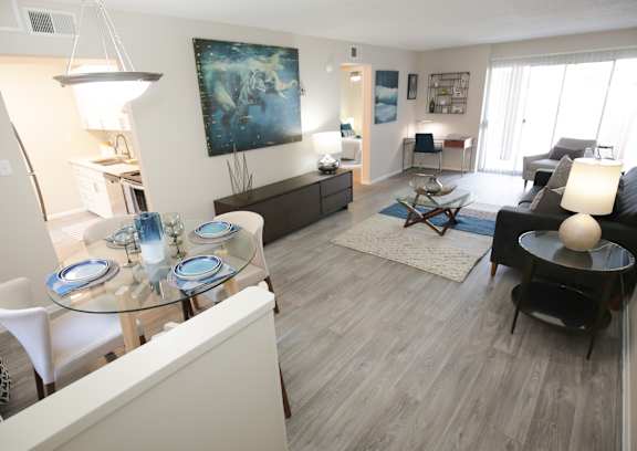 a view of a living room and dining room from the kitchen