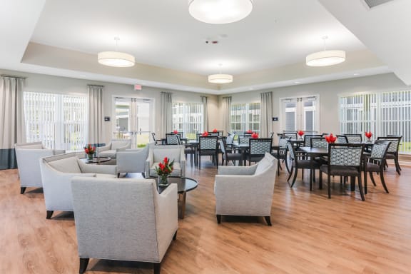 the reserve at bucklin hill clubhouse with tables and chairs