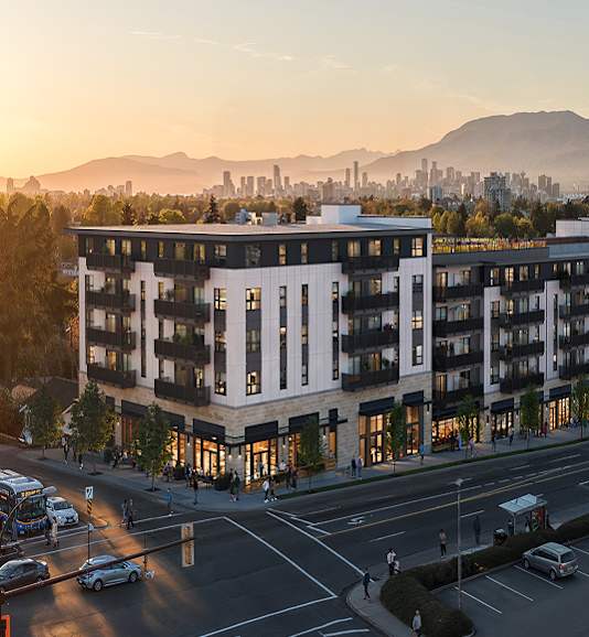 A modern building with a parking lot in front of it.