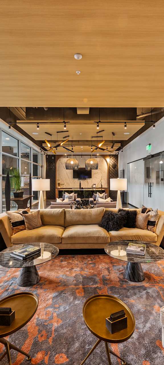 the lobby of a building with couches and tables  at South and Hollis, Charlotte, NC, 28209
