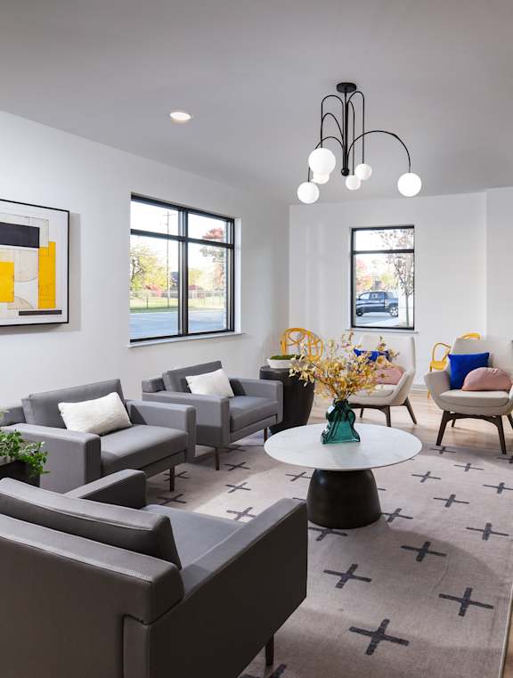 A modern kitchen with a dining table and chairs.
