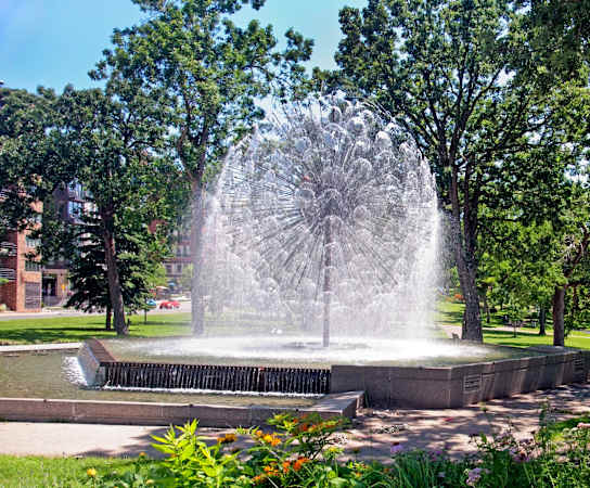 a fountain in the middle of a park