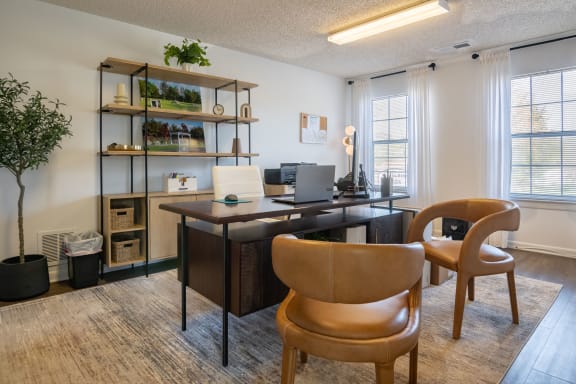 the preserve at ballantyne commons cyber office area with desk and chairs and shelves