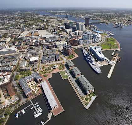 an aerial view of a harbor with a cruise ship in the water and a city at Gates of West Bay, Norfolk Virginia