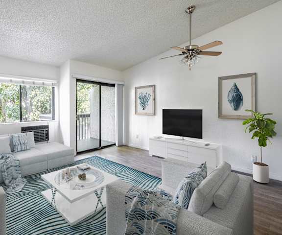 a living room with two couches and a tv