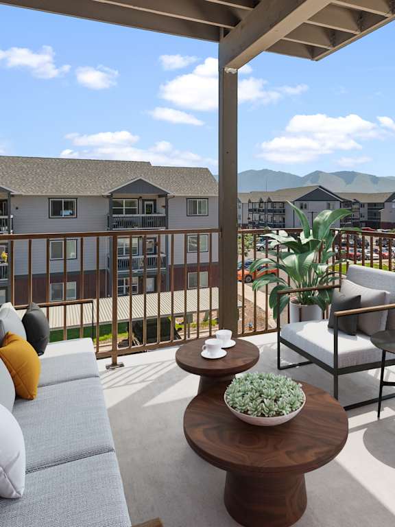 a balcony with couches and chairs and a coffee table