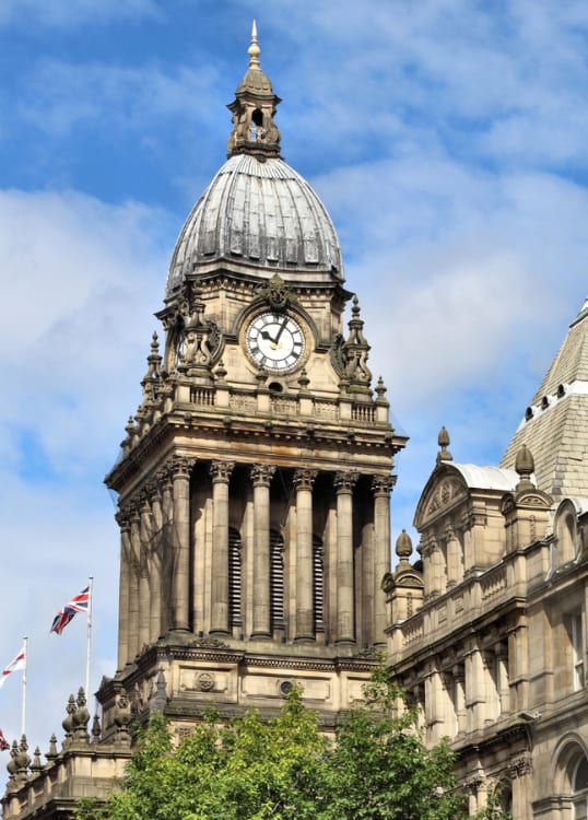 the clock tower of the big building