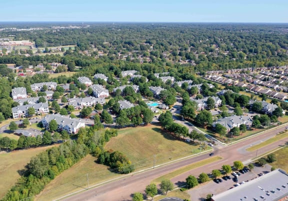 an aerial view of a neighborhood with houses and trees